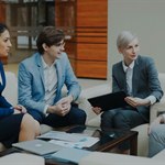 Business people discussing documents in a meeting