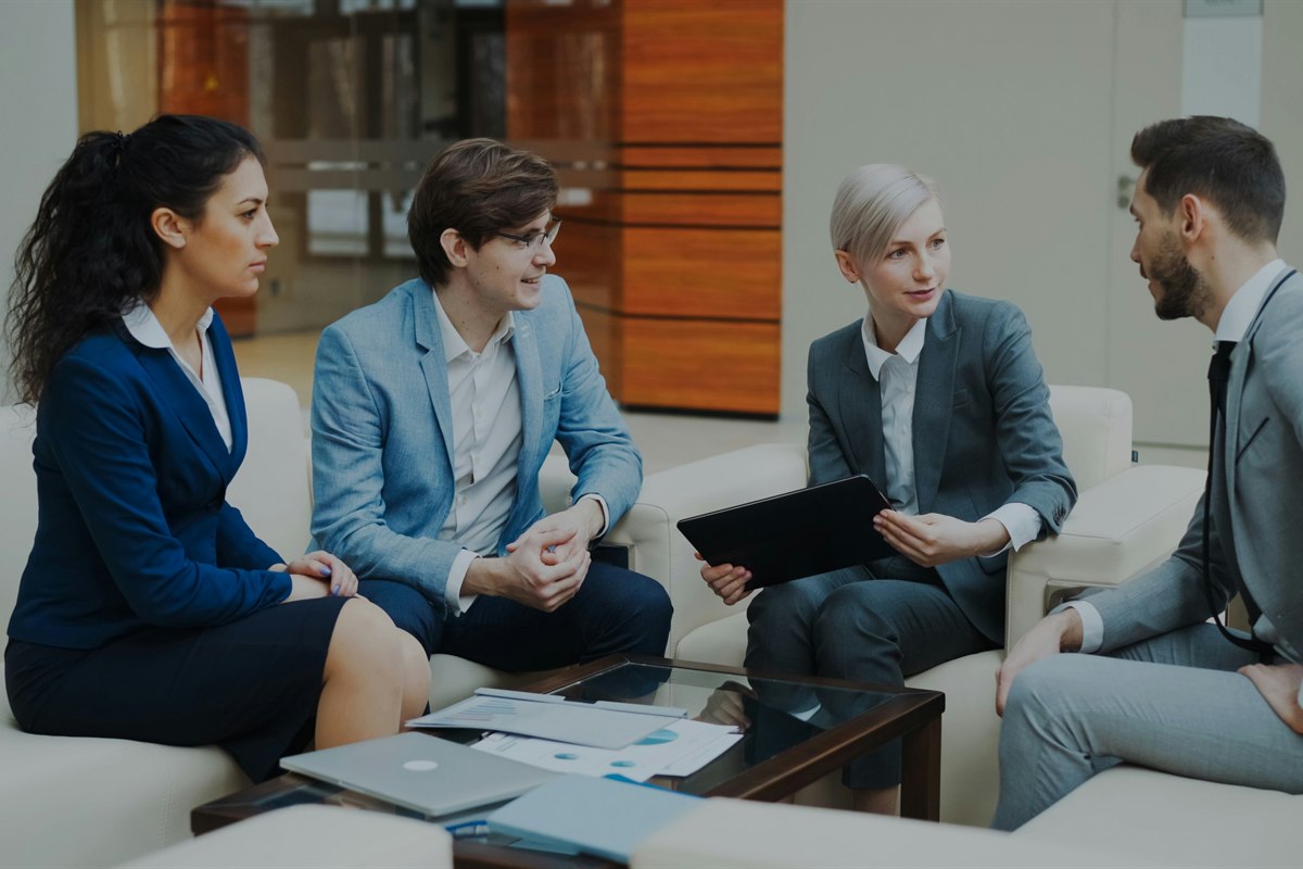 Business people discussing documents in a meeting