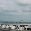 Cars parked near an airport terminal