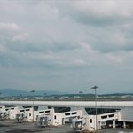 Cars parked near an airport terminal